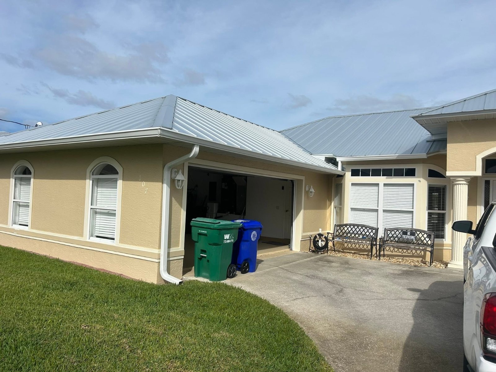 Brevard County home with new white seamless gutters by Catch & Release